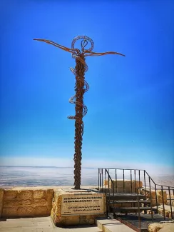 A monument of the bronze serpent (which Moses erected in the Neghev desert) on Mount Nebo, in front of the church of Saint Moses (2018).
